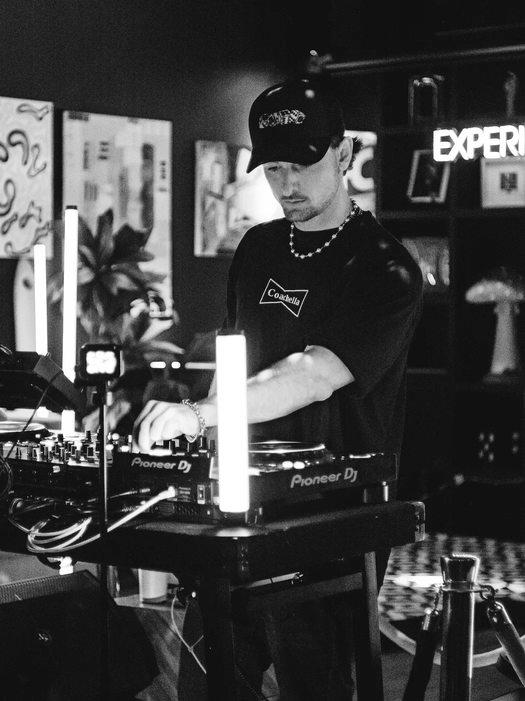 AUSTAL DJing at a club show, black and white
