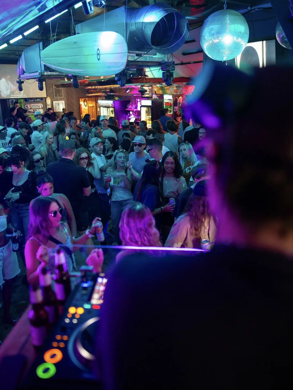 Wide crowd shot at a beach-themed venue